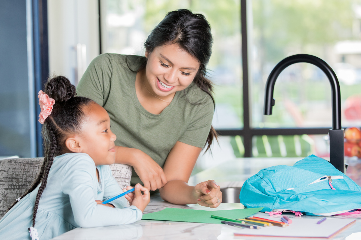 Babysitter and child colouring